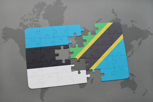 Puzzle with the national flag of estonia and tanzania on a world map — Stock Photo, Image