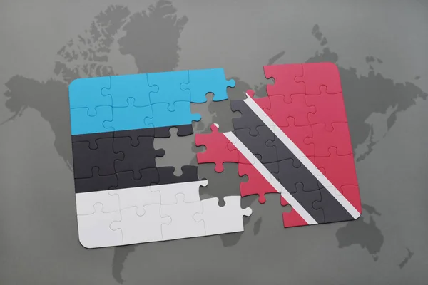 Puzzle s národní vlajkou Estonska a trinidad a tobago na mapě světa — Stock fotografie