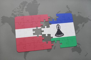 bir dünya haritası üzerinde Letonya ve Lesoto bayrağı ulusal ile bulmaca