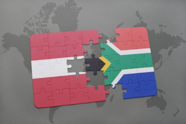 Letonya ve Güney Afrika ulusal bayrak bir dünya haritası üzerinde ile bulmaca