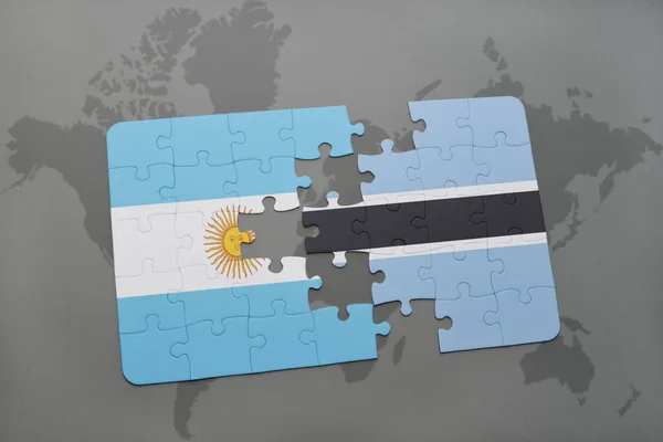 Rompecabezas con la bandera nacional de Argentina y Botswana en un mapa del mundo — Foto de Stock
