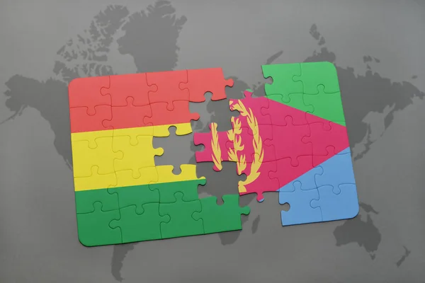 Puzzel met de nationale vlag van bolivia en eritrea op een wereldkaart — Stockfoto