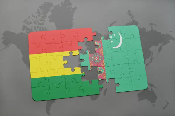 Puzzel met de nationale vlag van bolivia en turkmenistan op een wereldkaart — Stockfoto