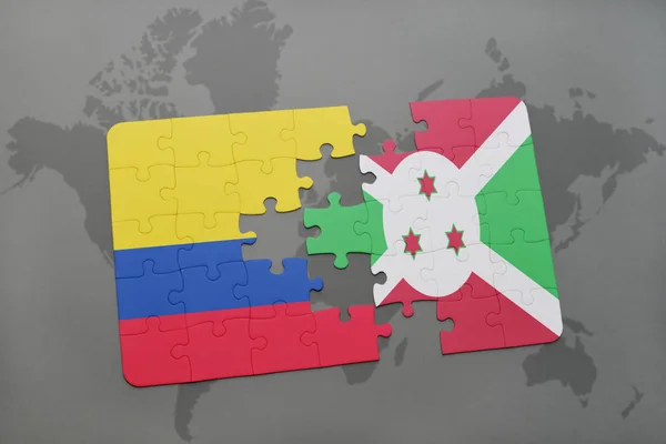 Quebra-cabeça com a bandeira nacional da colômbia e burundi em um mapa do mundo — Fotografia de Stock