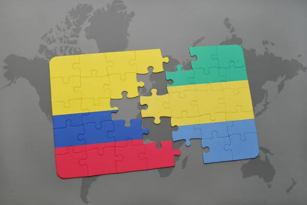 Rompecabezas con la bandera nacional de Colombia y Gabón en un mapa del mundo — Foto de Stock