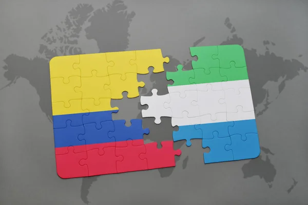 Puzzle avec le drapeau national de la Colombie et de la Sierra Leone sur une carte du monde — Photo