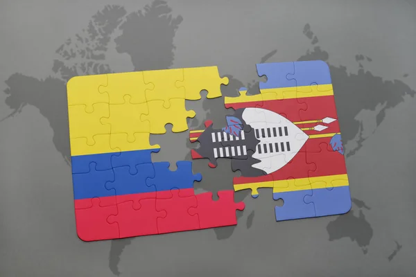 Puzzle com a bandeira nacional da colômbia e da Suazilândia num mapa mundial — Fotografia de Stock