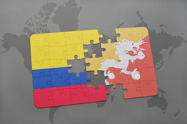 Rompecabezas con la bandera nacional de Colombia y Bután en un mapa del mundo — Foto de Stock