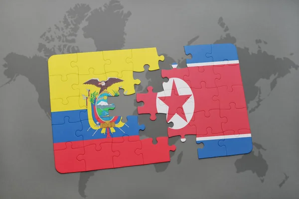 Puzzle s státní vlajka Ekvádoru a Severní Koreje na mapě světa — Stock fotografie