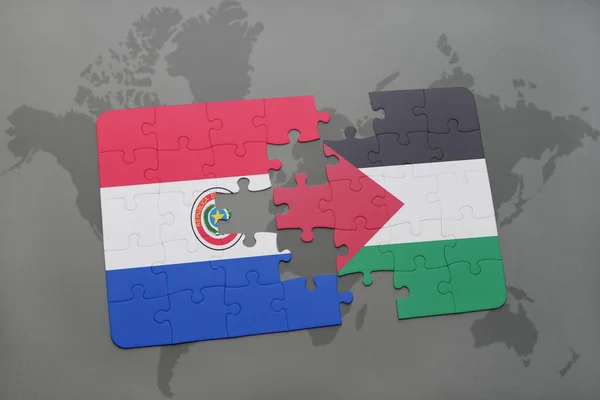 Quebra-cabeça com a bandeira nacional do paraguai e Palestina em um mapa do mundo — Fotografia de Stock