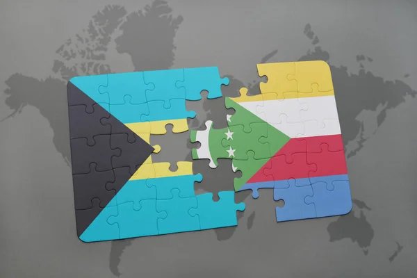 Головоломка с национальным флагом Багамских островов и коморов на карте мира — стоковое фото