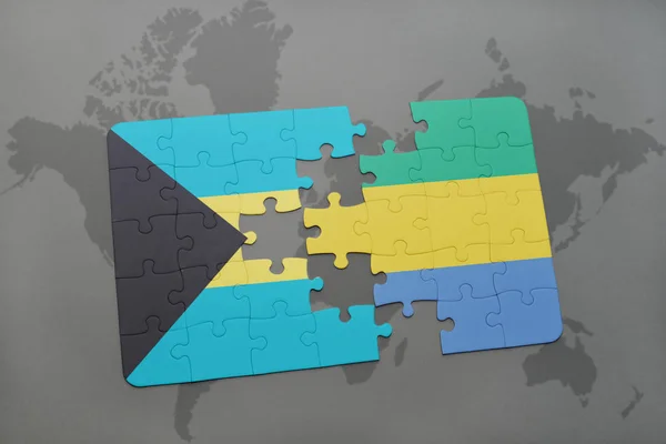 Rompecabezas con la bandera nacional de Bahamas y Gabón en un mapa del mundo —  Fotos de Stock