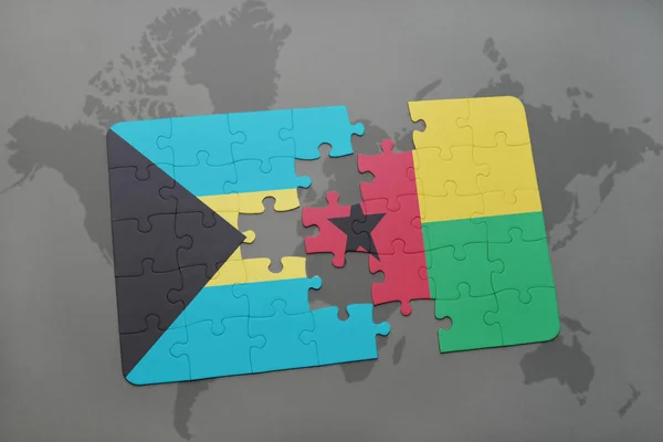 Puzzle s státní vlajka Baham a guinea bissau na mapě světa — Stock fotografie
