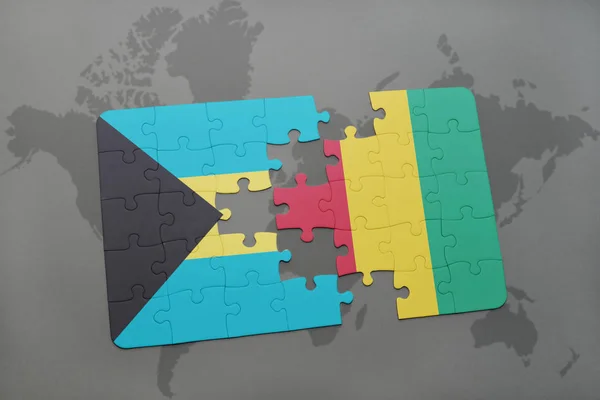 Головоломка с национальным флагом Багамов и Гвинеи на карте мира — стоковое фото