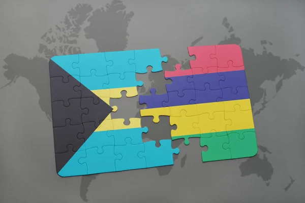 Puzzle avec le drapeau national des bahamas et des maurites sur une carte du monde — Photo