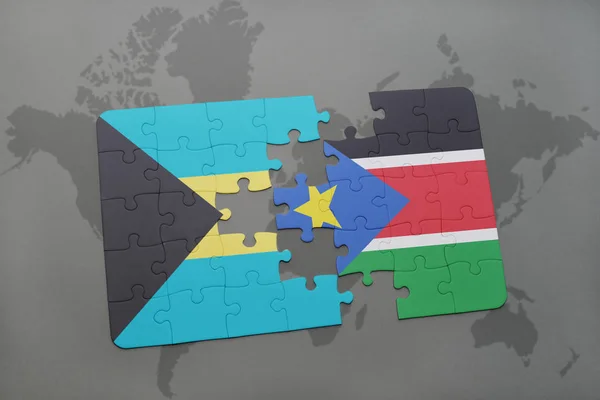 Rompecabezas con la bandera nacional de Bahamas y el sur de Sudán en un mapa del mundo — Foto de Stock