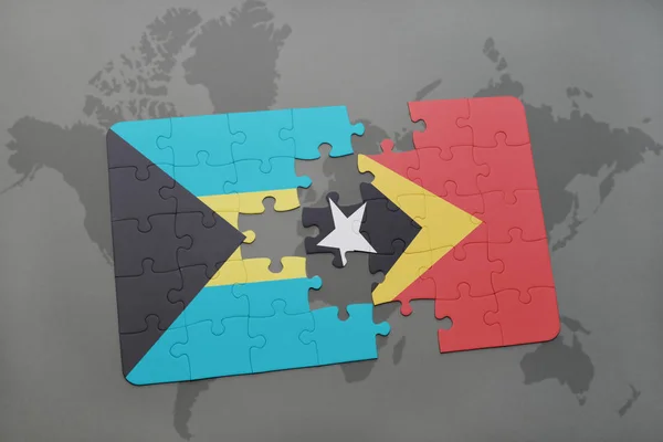 Rompecabezas con la bandera nacional de Bahamas y Timor Oriental en un mapa del mundo — Foto de Stock