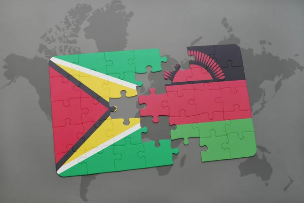 Rompecabezas con la bandera nacional de Guayana y Malawi en un mapa del mundo — Foto de Stock