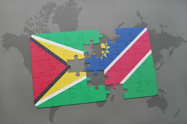 Rompecabezas con la bandera nacional de Guayana y Namibia en un mapa del mundo — Foto de Stock