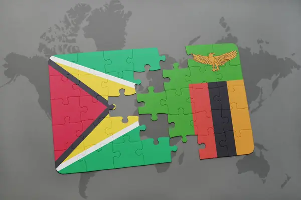 Rompecabezas con la bandera nacional de Guayana y Zambia en un mapa del mundo — Foto de Stock