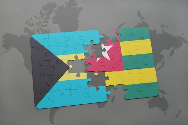 Puzzle con la bandiera nazionale di Bahamas e Togo su una mappa del mondo — Foto Stock