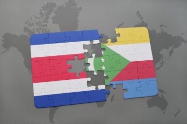 Kosta Rika ve Komor Adaları ulusal bayrak bir dünya haritası üzerinde ile bulmaca