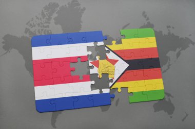 Kosta Rika ve Zimbabve Ulusal bayrak bir dünya haritası üzerinde ile bulmaca