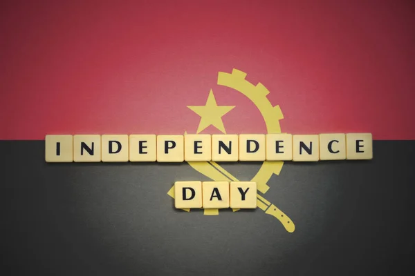 Letters with text independence day on the national flag of angola. — Stock Photo, Image