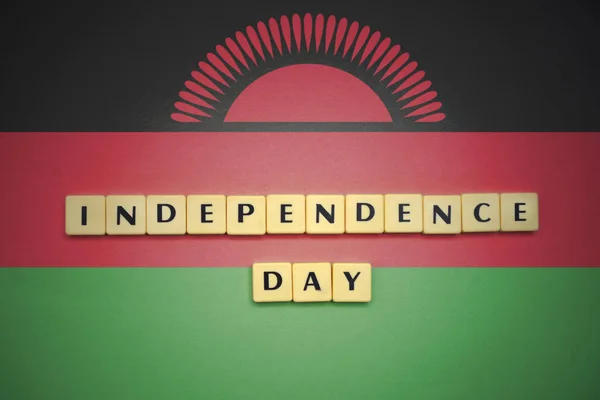 Letters with text independence day on the national flag of malawi. — Stock Photo, Image