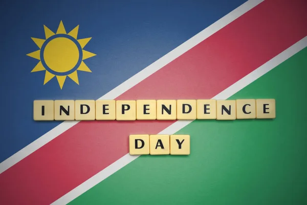 Letters with text independence day on the national flag of namibia. — Stock Photo, Image