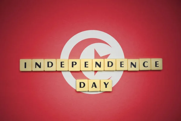 Irodalom-val szöveg függetlenség napja Tunézia zászlaja. — Stock Fotó