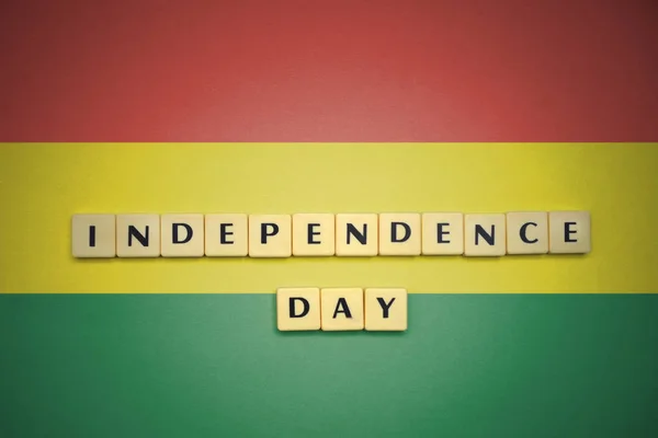 Letters with text independence day on the national flag of bolivia. — Stock Photo, Image