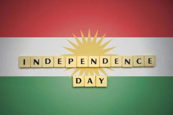 Letters with text independence day on the national flag of kurdistan. — Stock Photo, Image