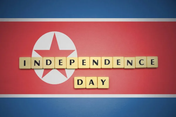Irodalom-val szöveg függetlenség napja Észak-korea zászlaja. — Stock Fotó