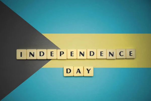 Letters with text independence day on the national flag of bahamas. — Stock Photo, Image