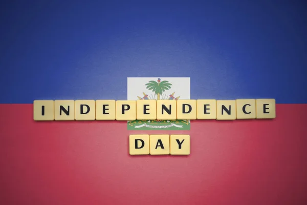Betűk, a szöveg a függetlenség napján a haiti zászlaja. — Stock Fotó