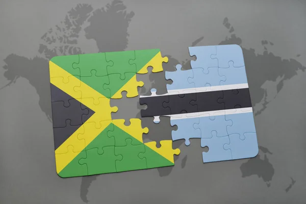 Rompecabezas con la bandera nacional de jamaica y botswana en un mapa del mundo — Foto de Stock