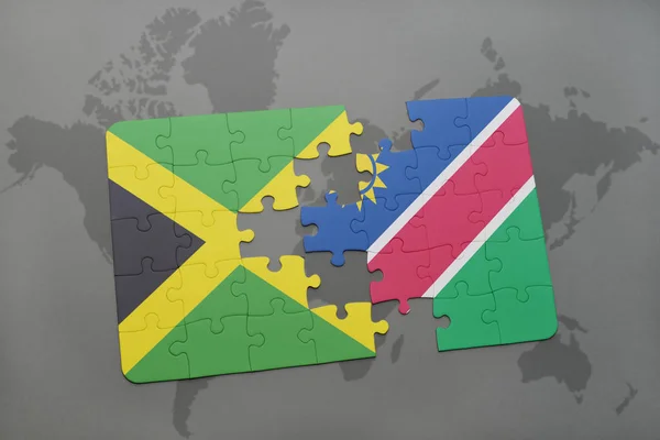 Rompecabezas con la bandera nacional de jamaica y namibia en un mapa del mundo — Foto de Stock