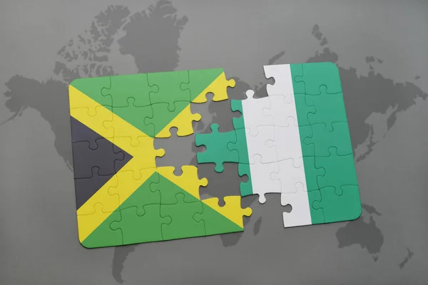 Puzzle avec le drapeau national de jamaica et nigeria sur une carte du monde — Photo