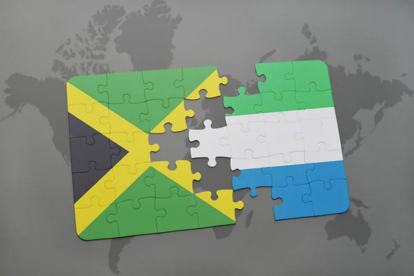 Rompecabezas con la bandera nacional de jamaica y Sierra Leona en un mapa del mundo — Foto de Stock