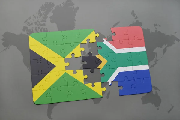 Rompecabezas con la bandera nacional de Jamaica y Sudáfrica en un mapa del mundo — Foto de Stock