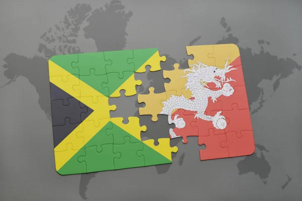 Rompecabezas con la bandera nacional de jamaica y Bután en un mapa del mundo — Foto de Stock