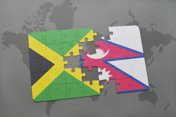 Rompecabezas con la bandera nacional de jamaica y nepal en un mapa del mundo — Foto de Stock