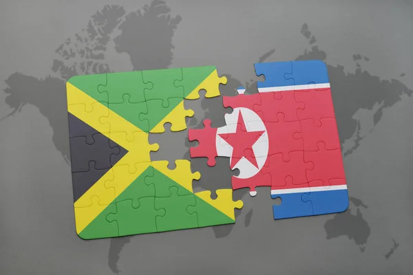Rompecabezas con la bandera nacional de jamaica y Corea del Norte en un mapa del mundo — Foto de Stock