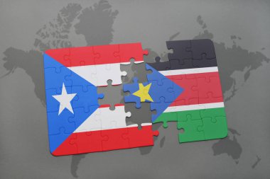 Porto Riko ve bir dünya haritası üzerinde Güney sudan bayrağı ile bulmaca