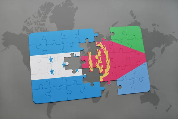 Rompecabezas con la bandera nacional de honduras y eritrea en un mapa del mundo — Foto de Stock