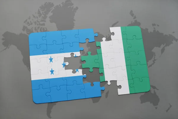 Παζλ με την εθνική σημαία της Ονδούρας και της Νιγηρίας σε έναν παγκόσμιο χάρτη — Φωτογραφία Αρχείου