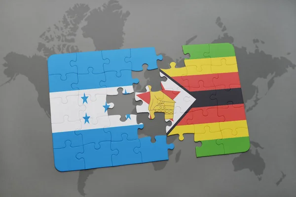 Rompecabezas con la bandera nacional de honduras y zimbabwe en un mapa del mundo —  Fotos de Stock