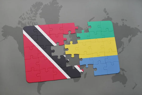 Puzzle avec le drapeau national de Trinidad et tobago et le gabon sur une carte du monde — Photo