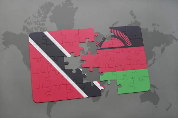 Puzzle avec le drapeau national de Trinidad et tobago et malawi sur une carte du monde — Photo